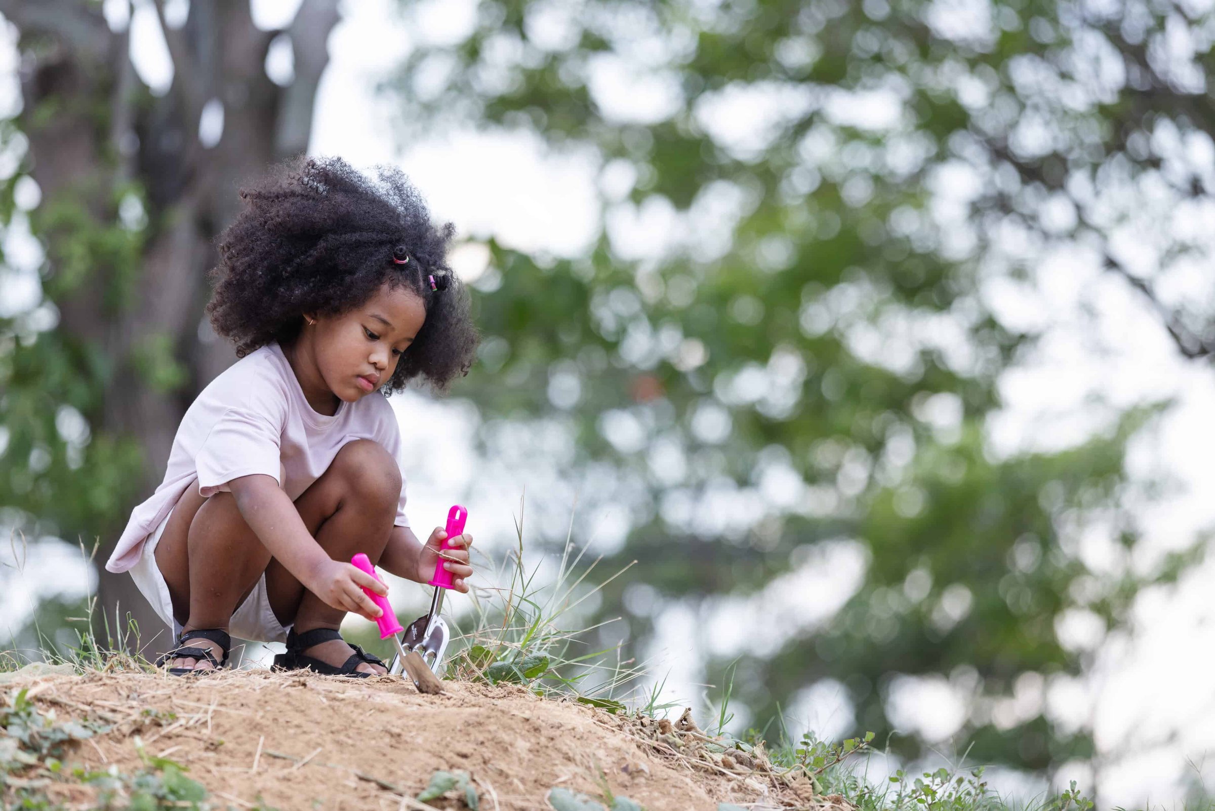 a-young-girl-with-curly-hair-is-happily-playing-ou-2025-02-14-22-54-41-utc