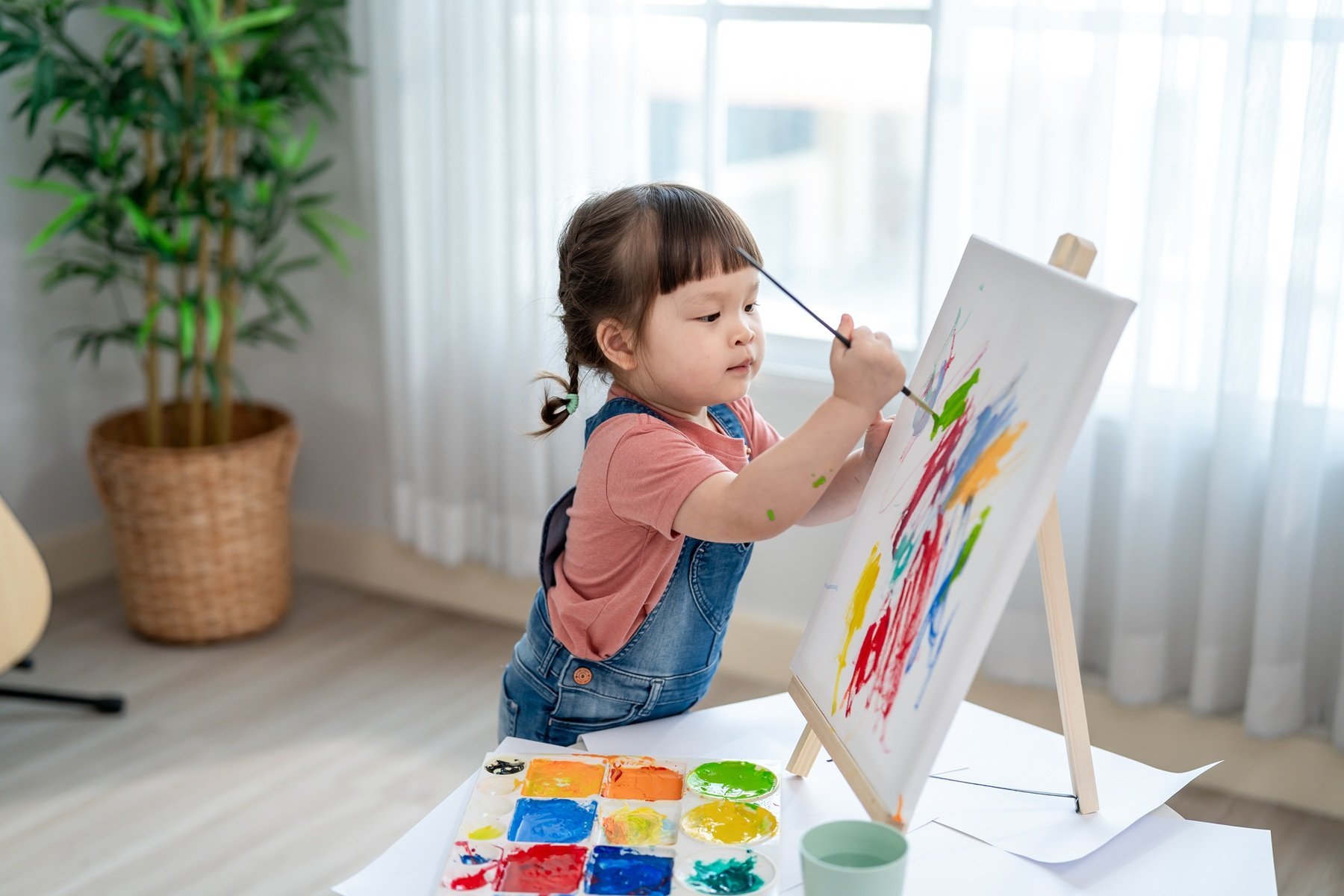adorable-toddler-happily-painting-at-home-indoors-2026-03-20-05-42-32-utc