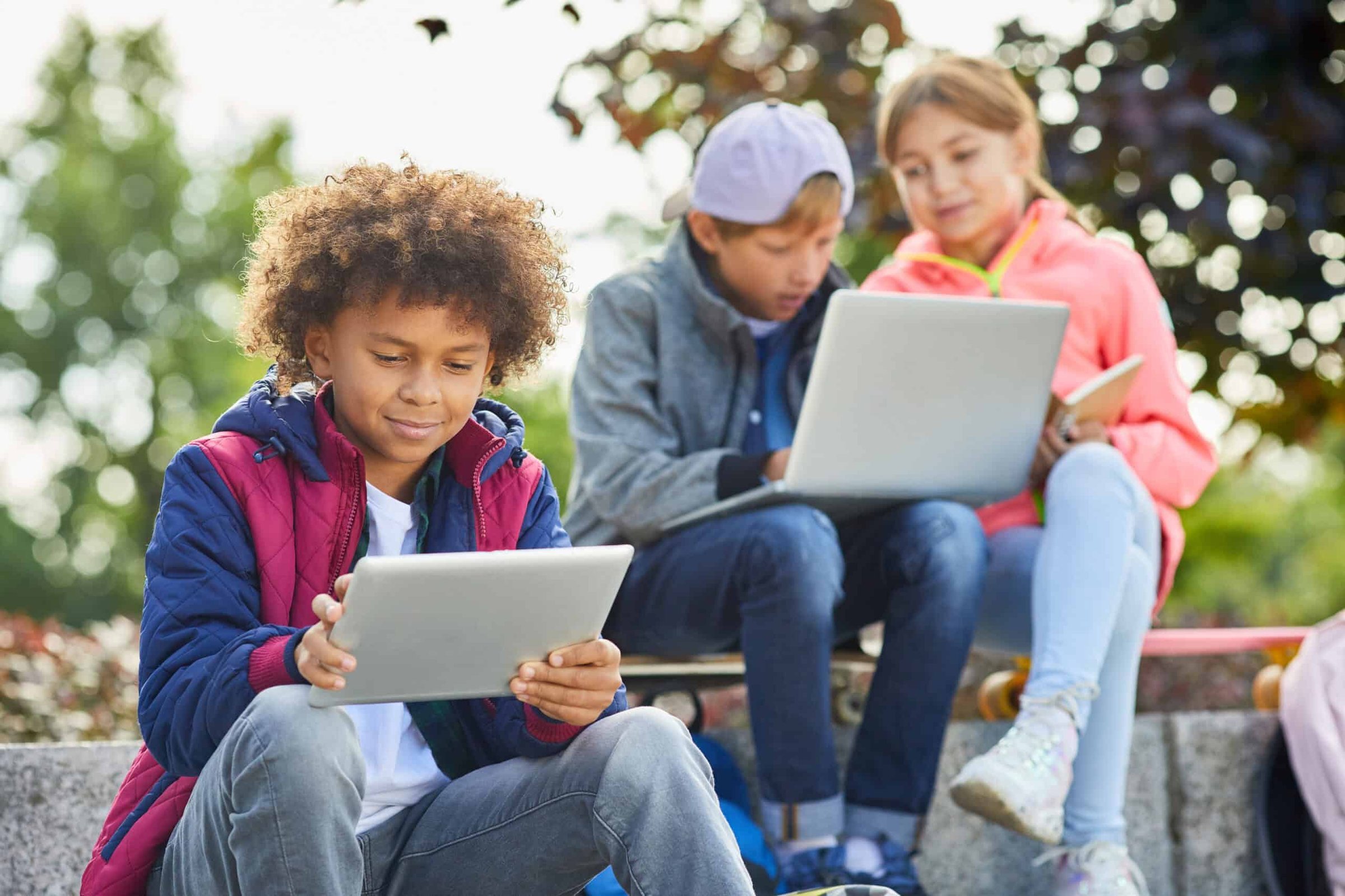 african-boy-with-tablet-pc-outdoors-2025-02-11-15-38-32-utc-scaled