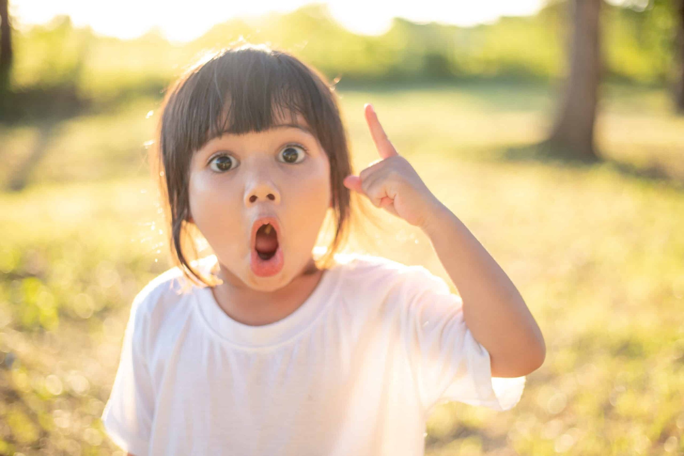 asian-little-girl-smiling-and-pointing-up-with-the-2025-02-12-23-15-20-utc-scaled