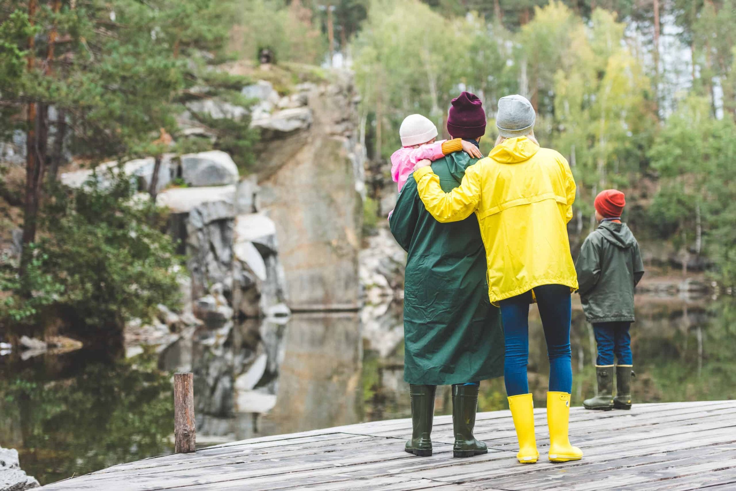 back-view-of-family-standing-on-wooden-bridge-toge-2024-11-08-04-49-00-utc-scaled