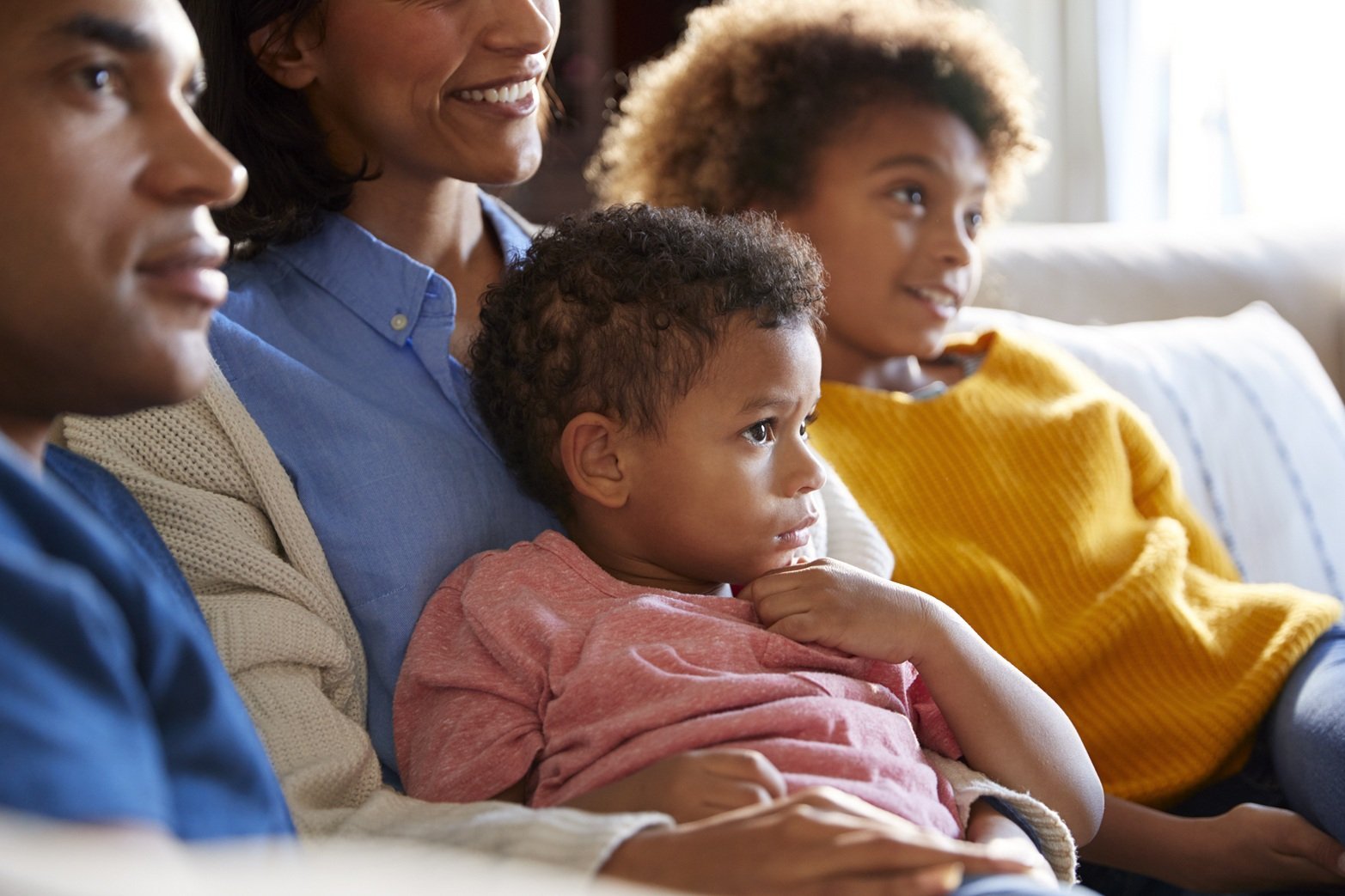 children-sitting-on-the-sofa-in-their-living-room-2026-03-10-03-15-51-utc