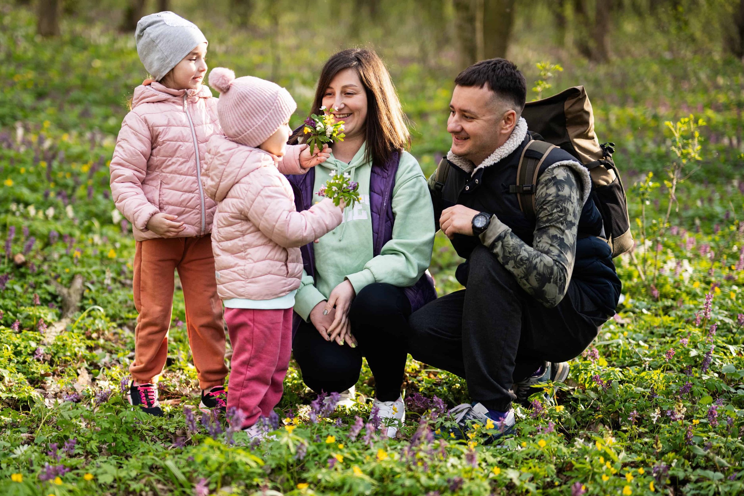 family-with-two-daughters-on-sunny-forest-outdoor-2025-02-11-02-14-47-utc
