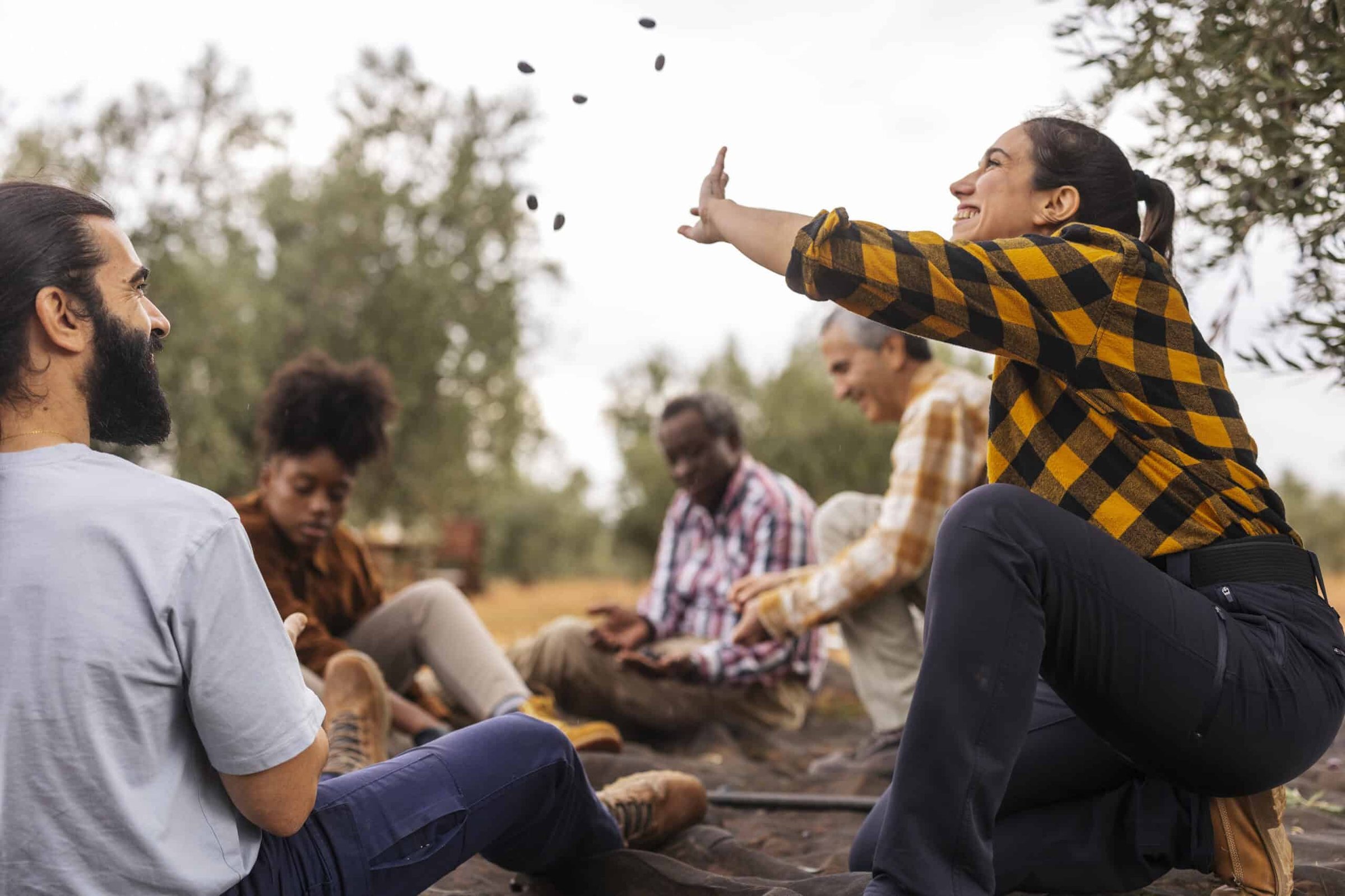 farmers-throwing-olives-in-the-air-during-harvest-2025-02-21-07-49-29-utc-scaled