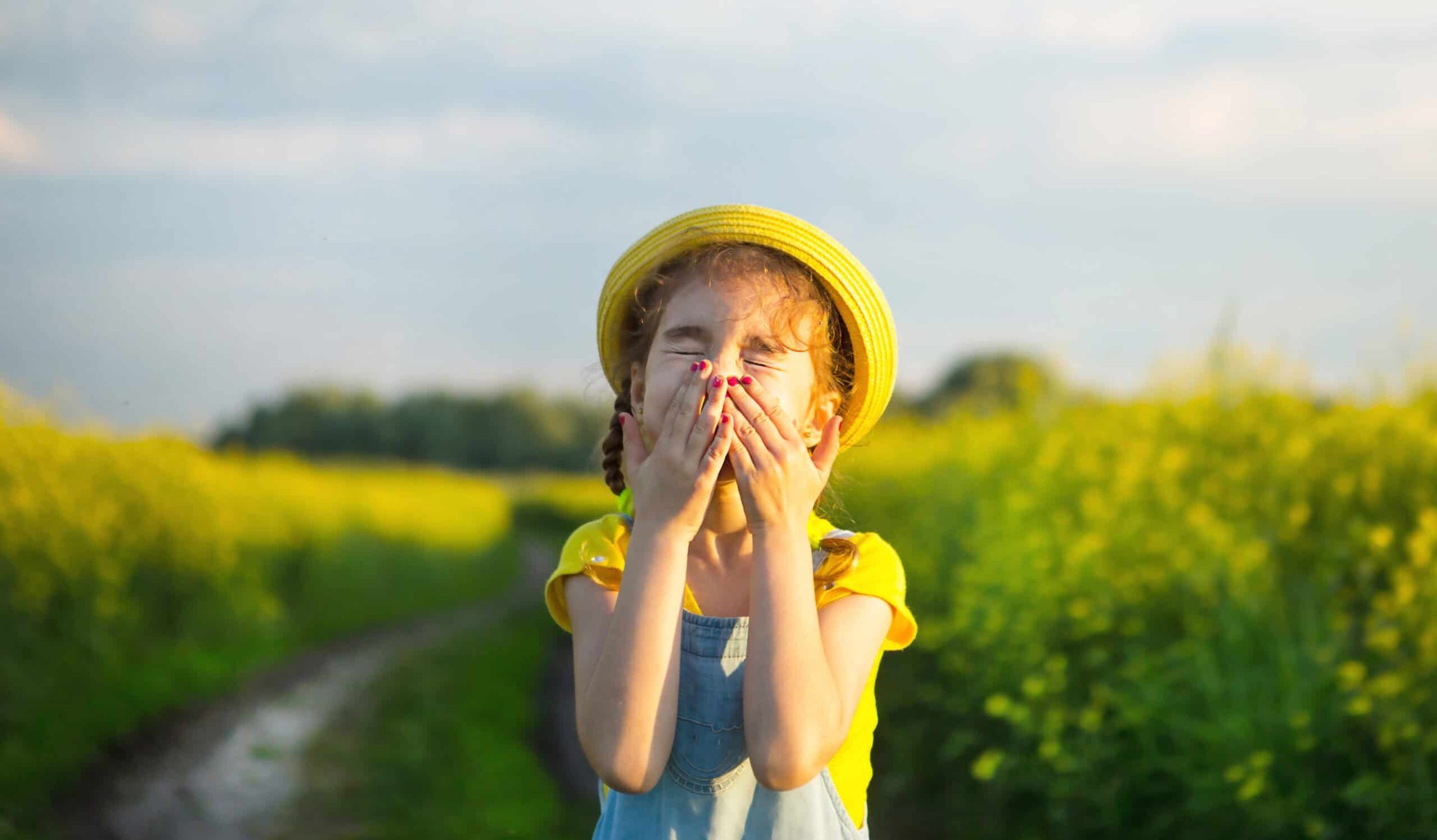 girl-in-yellow-blooming-field-covered-her-nose-and-2024-11-01-15-25-55-utc-scaled