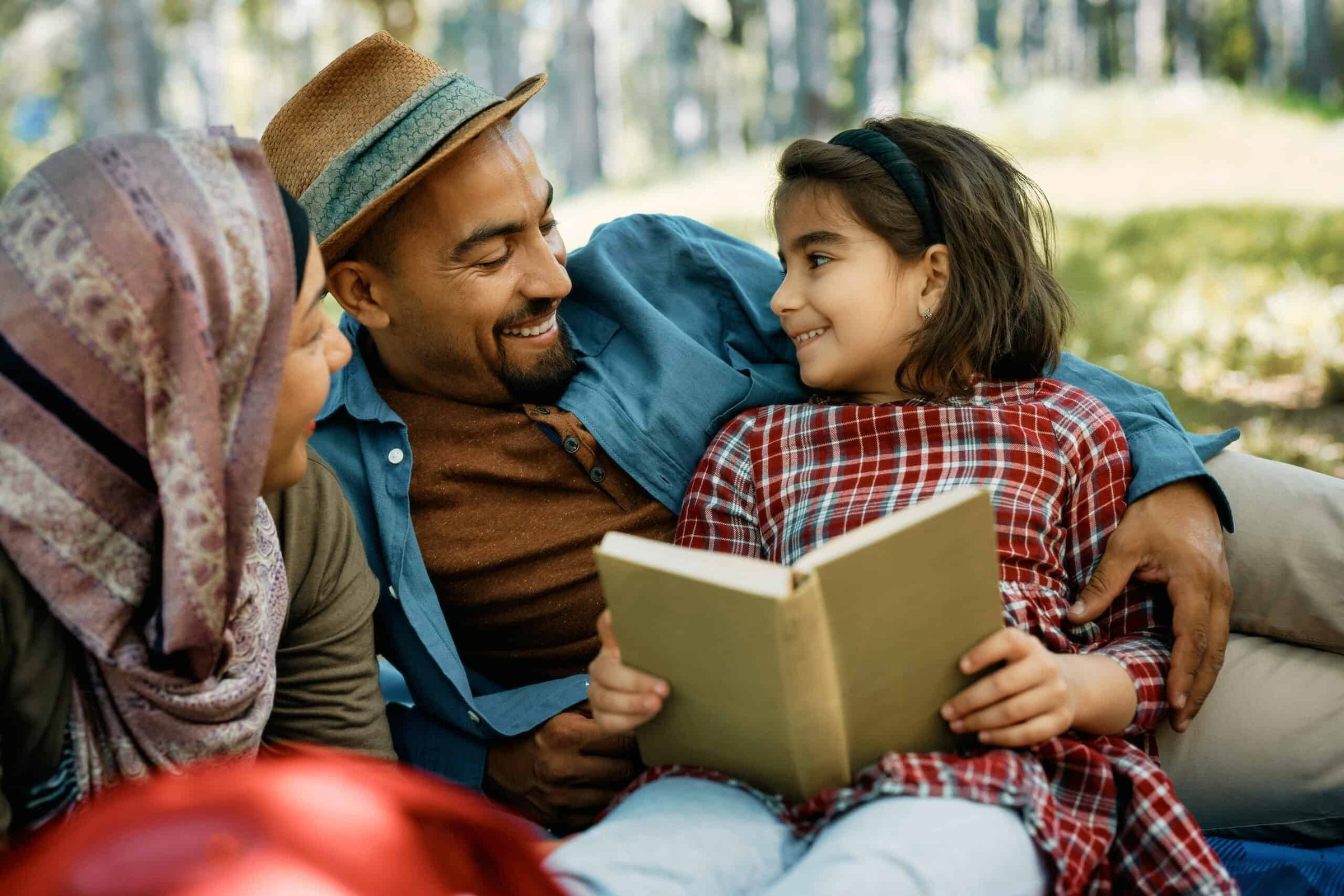 happy-muslim-family-talking-during-picnic-day-in-t-2024-12-13-17-09-14-utc-scaled
