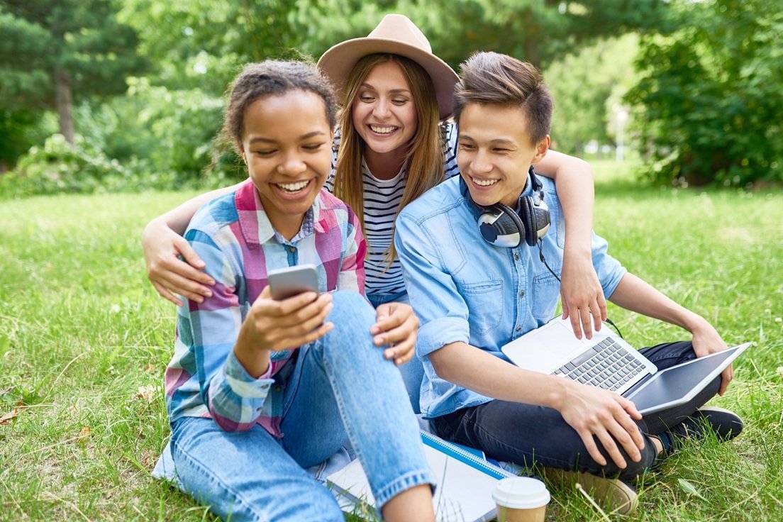 happy-students-enjoying-break-on-green-lawn-2026-01-08-07-35-11-utc