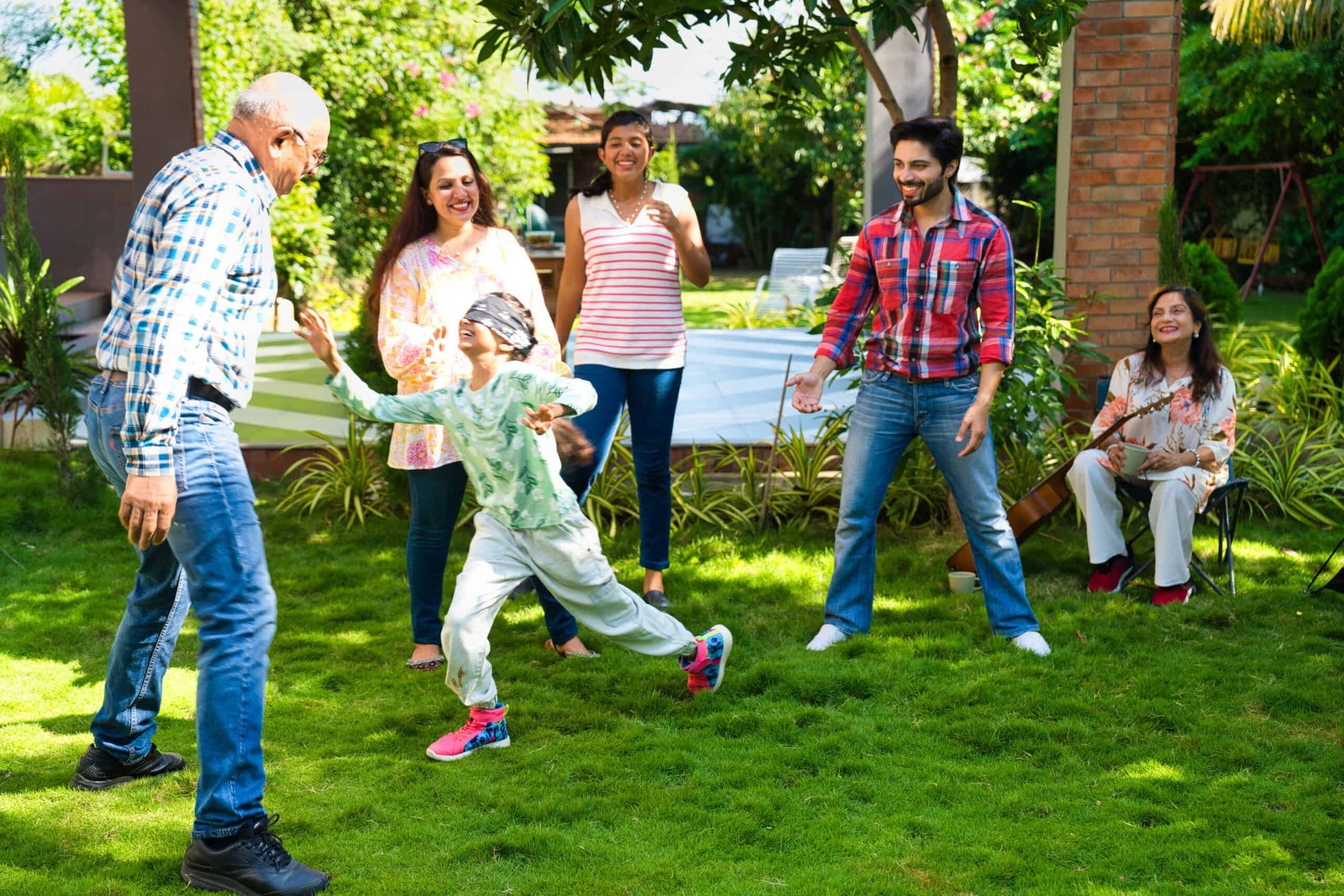 indian-family-of-six-happily-playing-a-blindfold-g-2025-01-16-13-06-24-utc-scaled