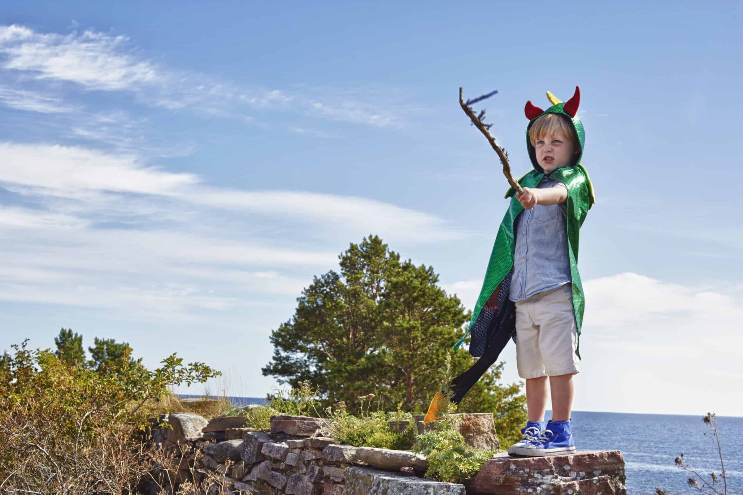 little-adventurer-in-dragon-cape-standing-proud-on-2025-04-03-05-09-47-utc-scaled