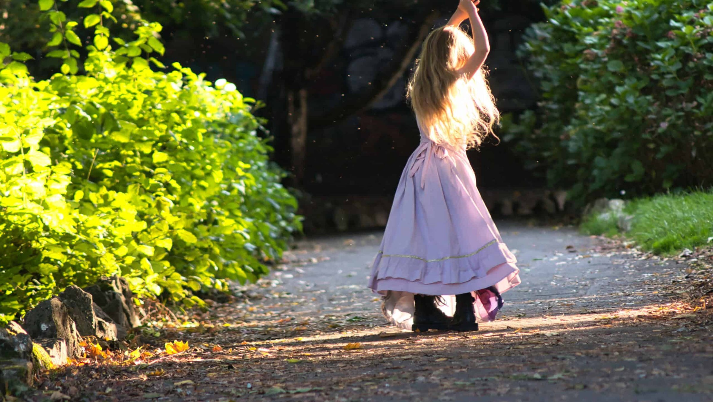 little-girl-wearing-a-dress-and-dancing-in-a-park-2025-02-09-21-04-29-utc-scaled