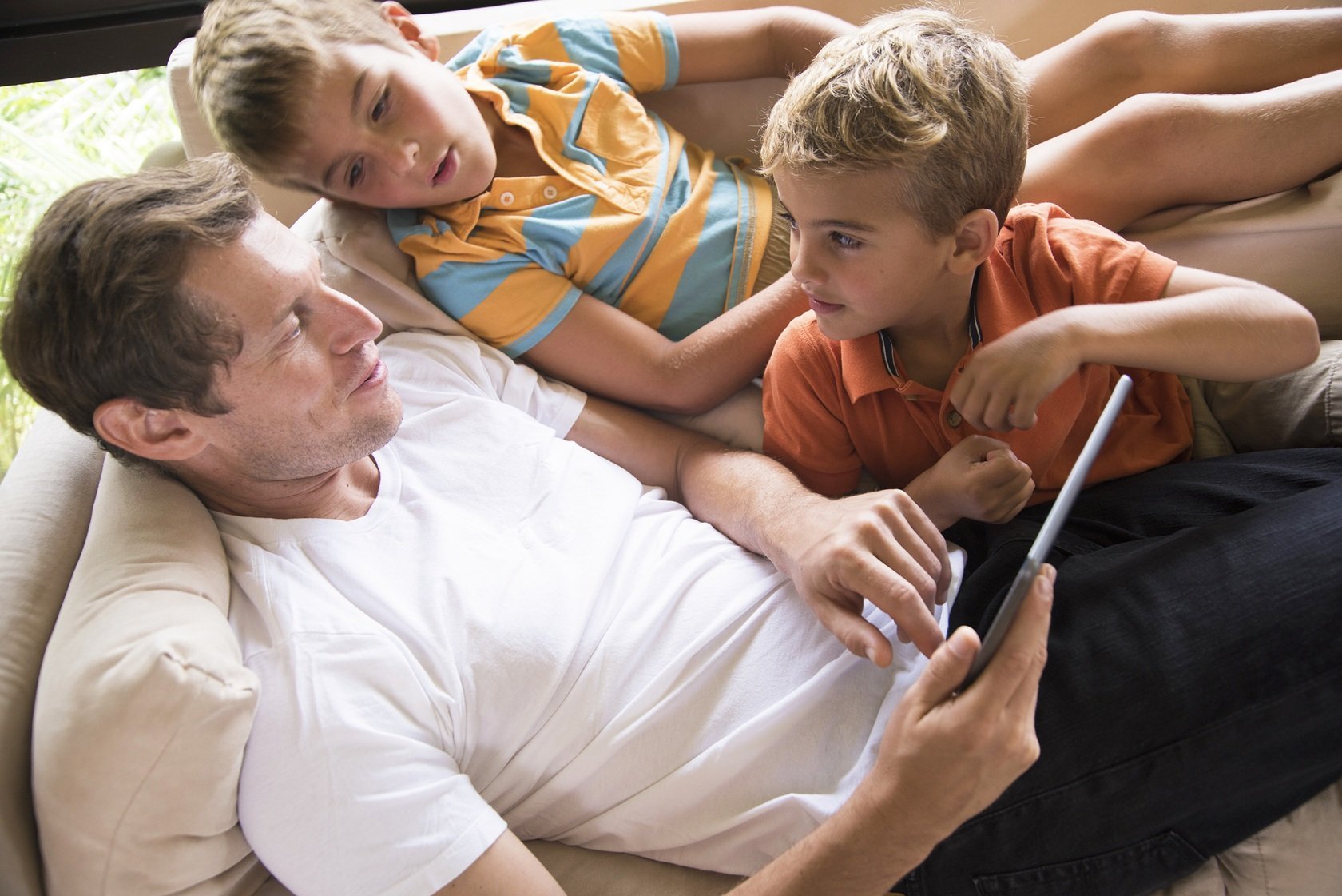 man-and-two-sons-using-digital-tablet-touchscreen-2026-03-25-03-49-44-utc