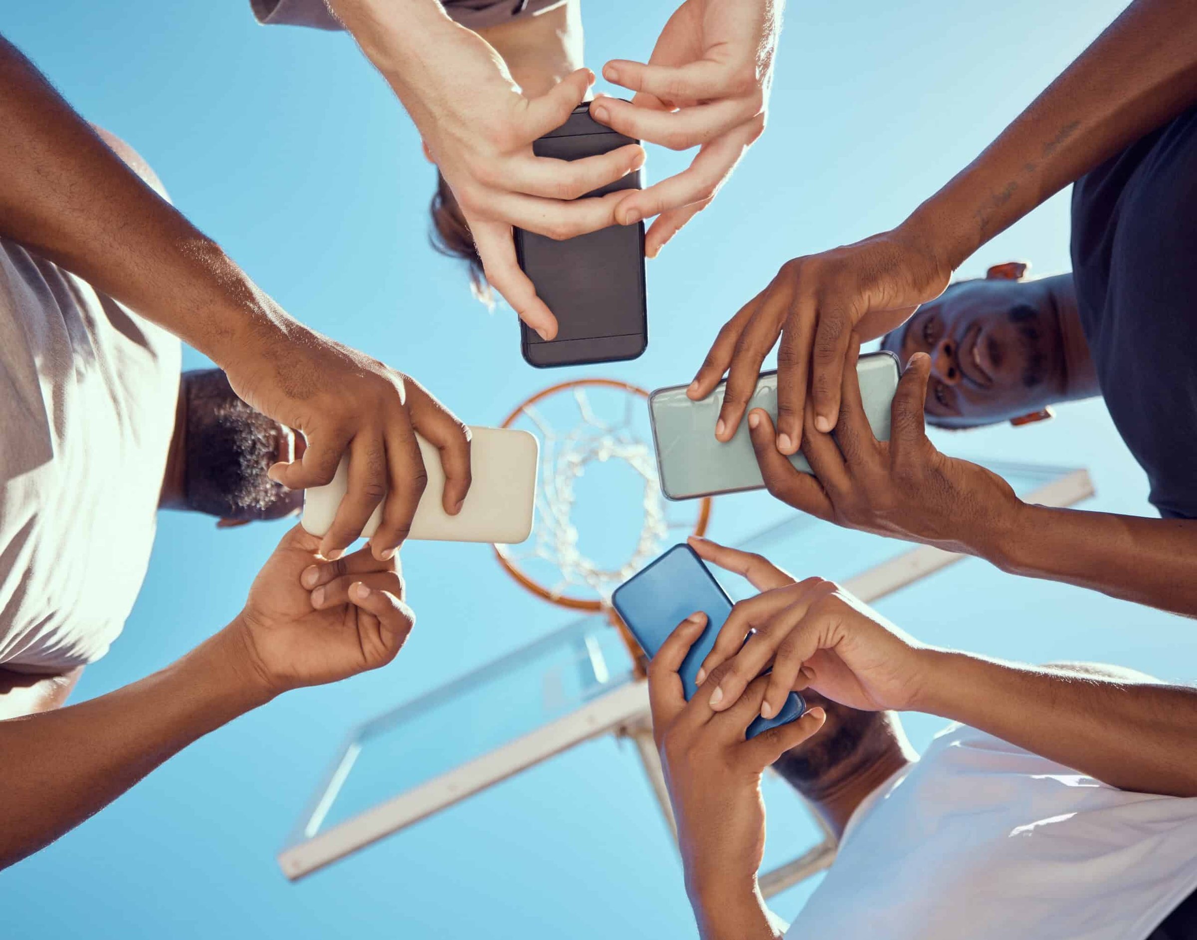men-in-a-circle-with-phones-networking-on-social-m-2023-11-27-04-52-06-utc-scaled