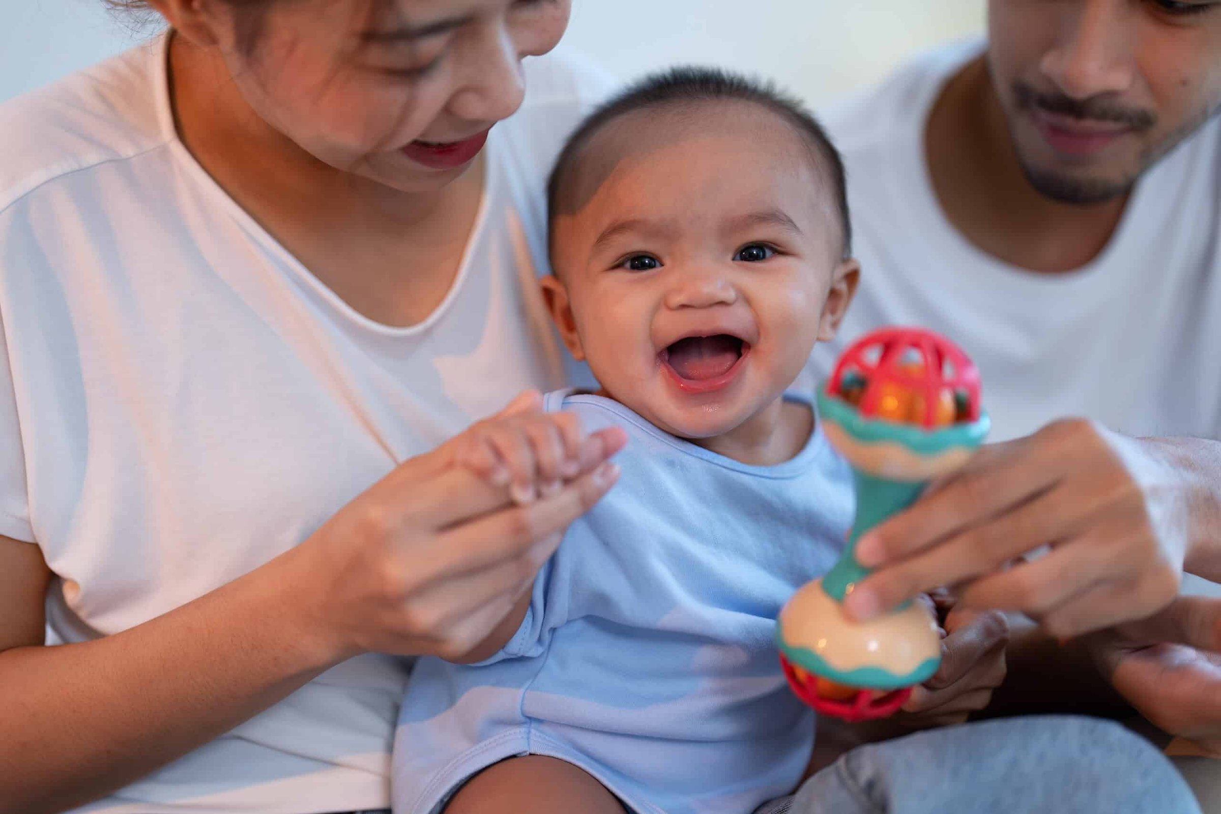 mom-and-father-laughing-joyful-teasing-asian-infan-2024-10-14-20-28-16-utc-scaled