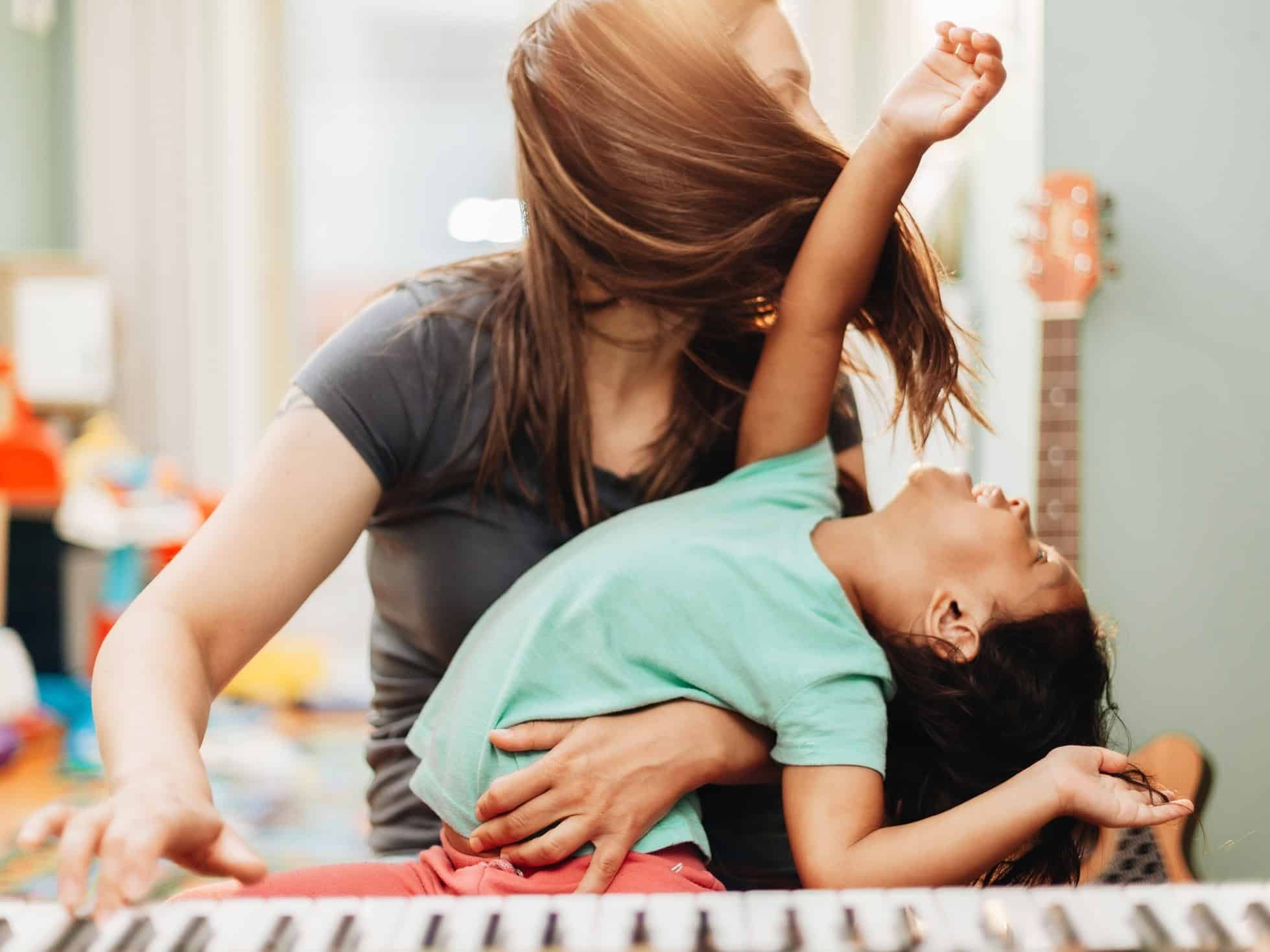 mother-and-daughter-at-home-playing-music-on-a-pia-2024-11-01-02-33-16-utc