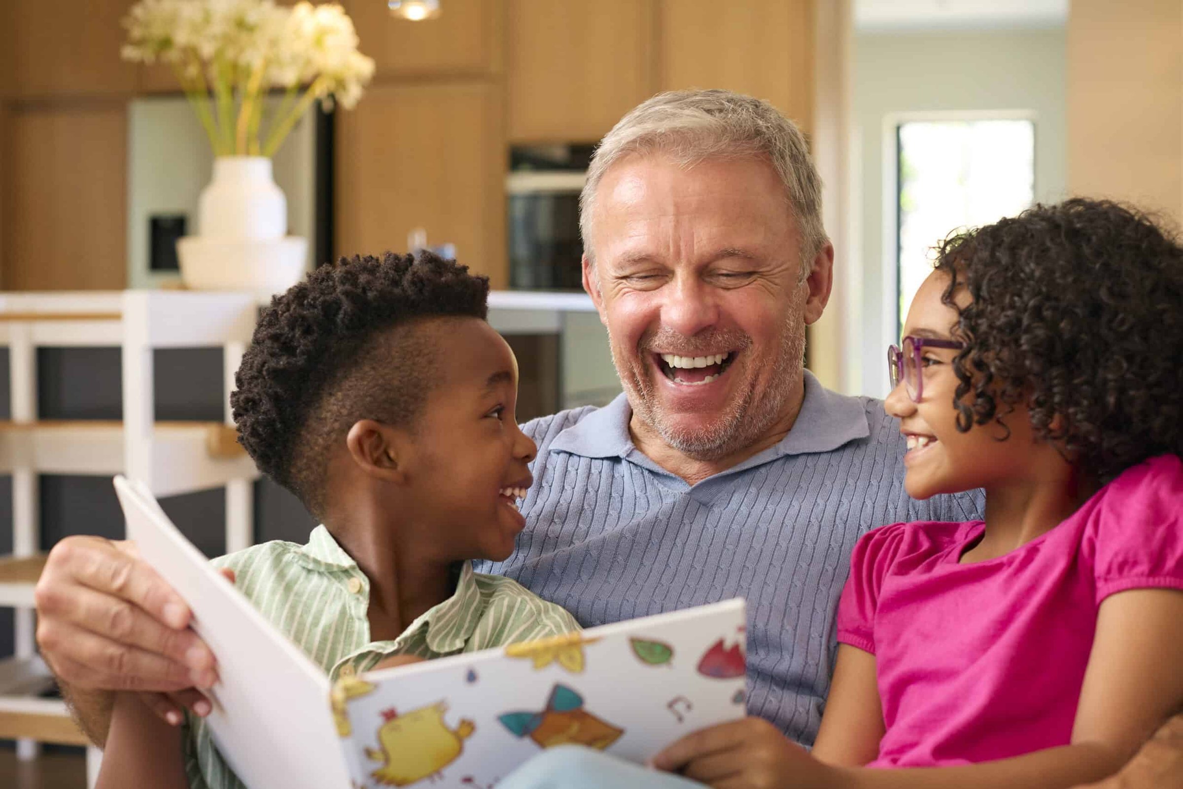 multi-racial-family-with-grandfather-looking-after-2024-10-20-21-17-03-utc-scaled