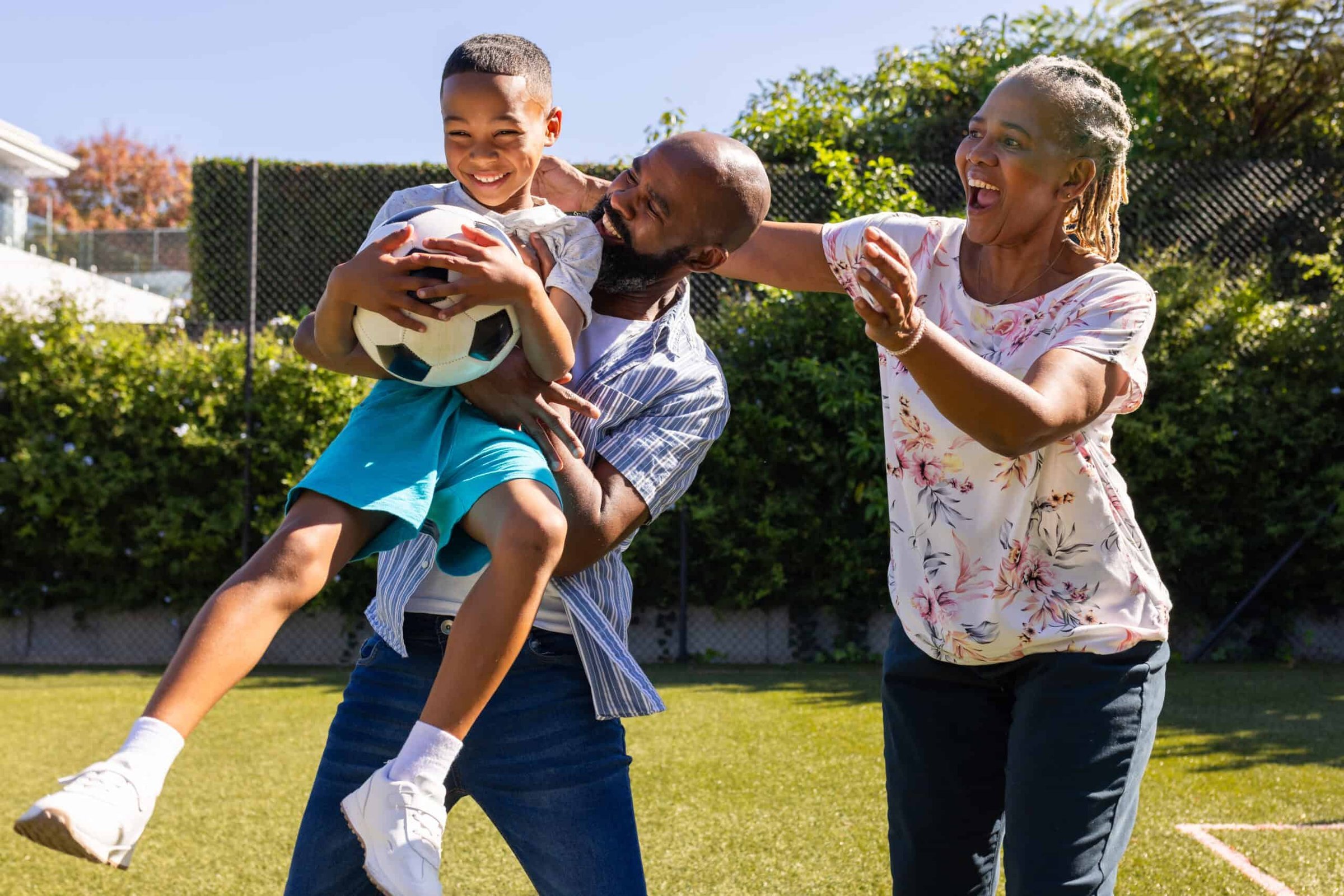 playing-with-soccer-ball-grandparents-and-grandson