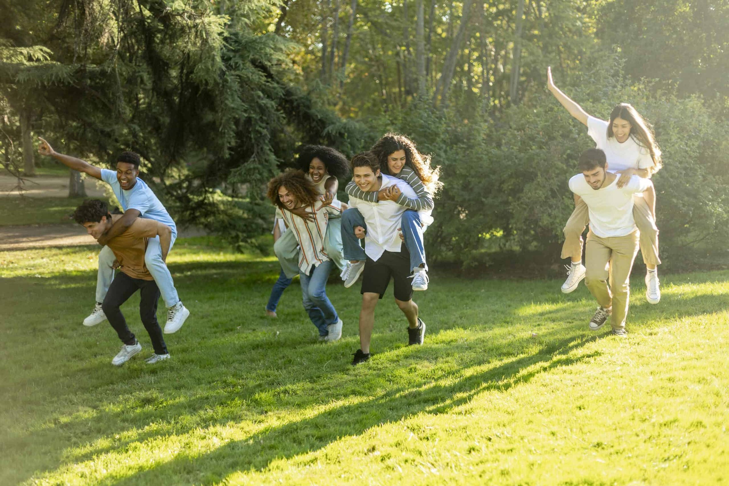 three-friends-giving-piggyback-rides-to-their-girl-2025-03-08-15-47-18-utc-scaled