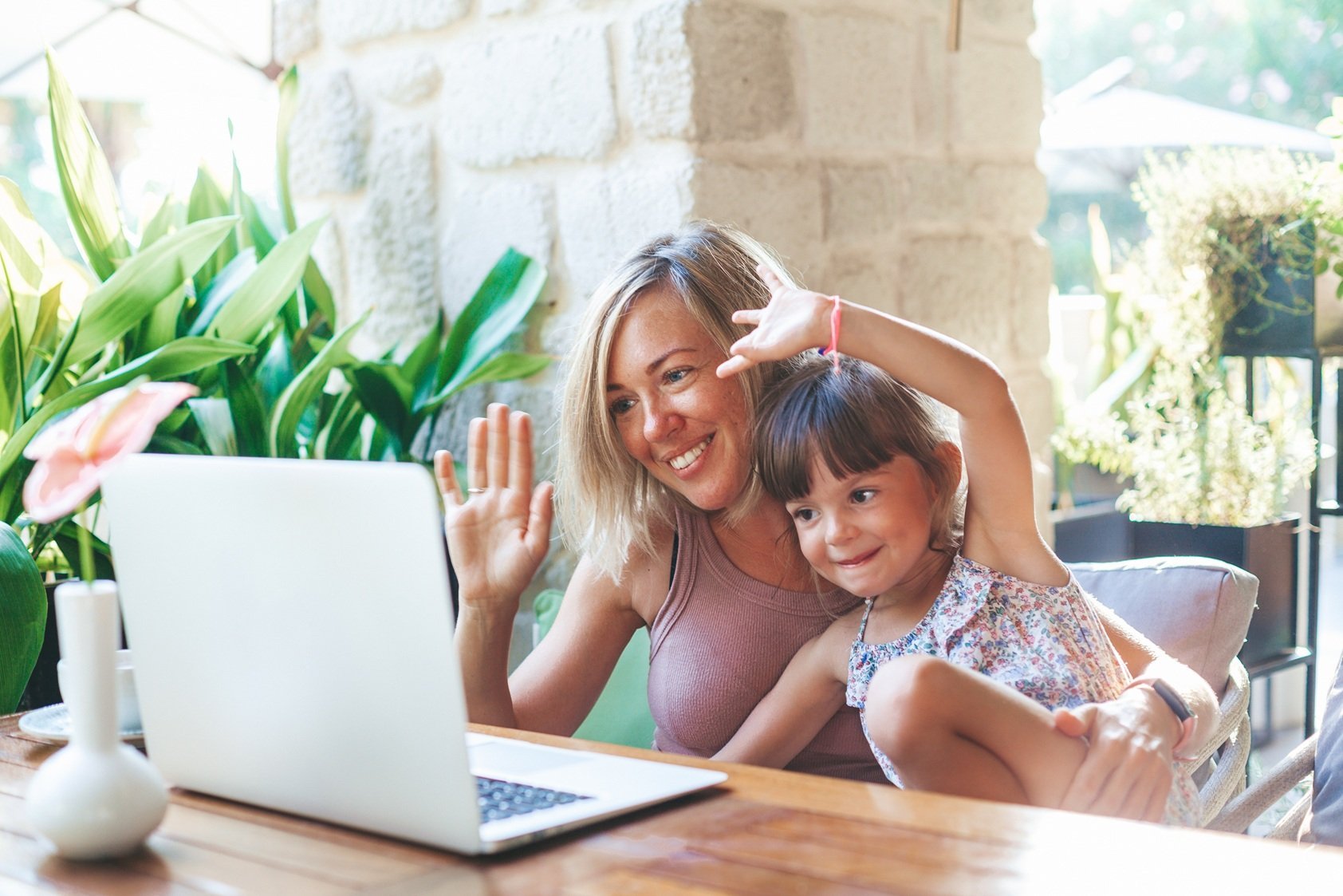 woman-and-child-waving-during-video-call-2026-01-07-23-15-52-utc