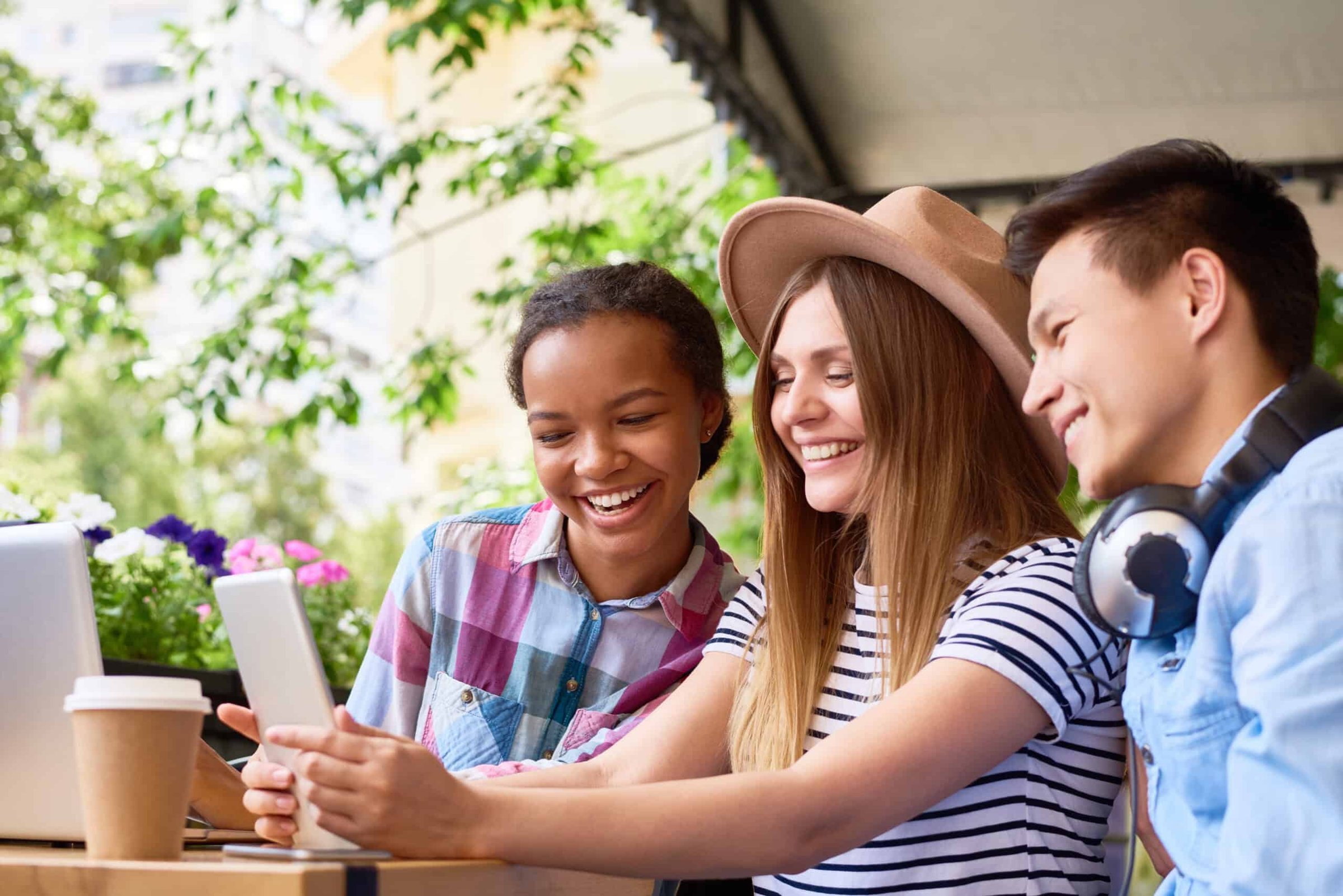 young-people-using-computers-in-cafe-2023-11-27-05-17-54-utc-scaled